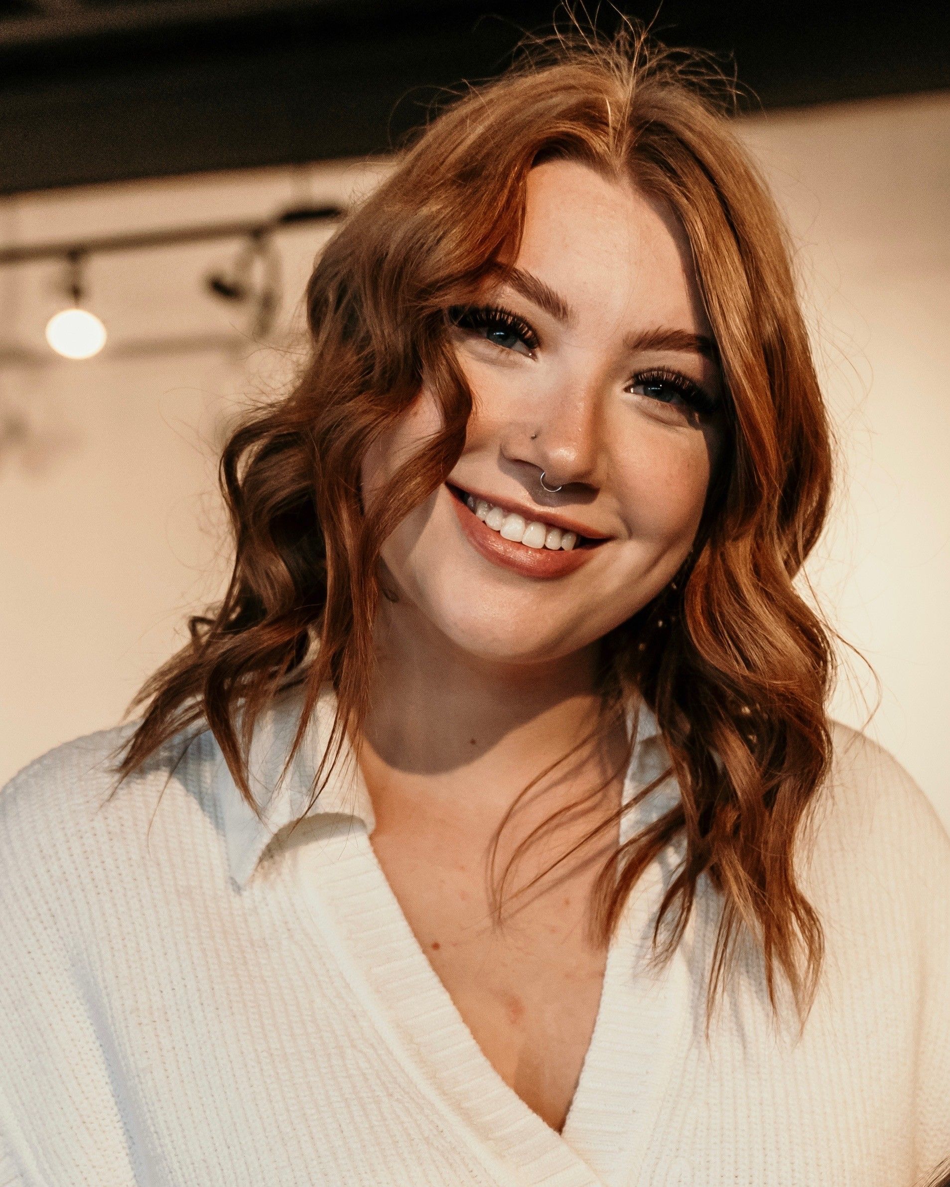 Hannah, the owner of Bold & Boozy, smiling